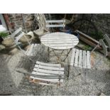 VINTAGE BISTRO SET, a metal framed circular slatted table with 4 matching chairs