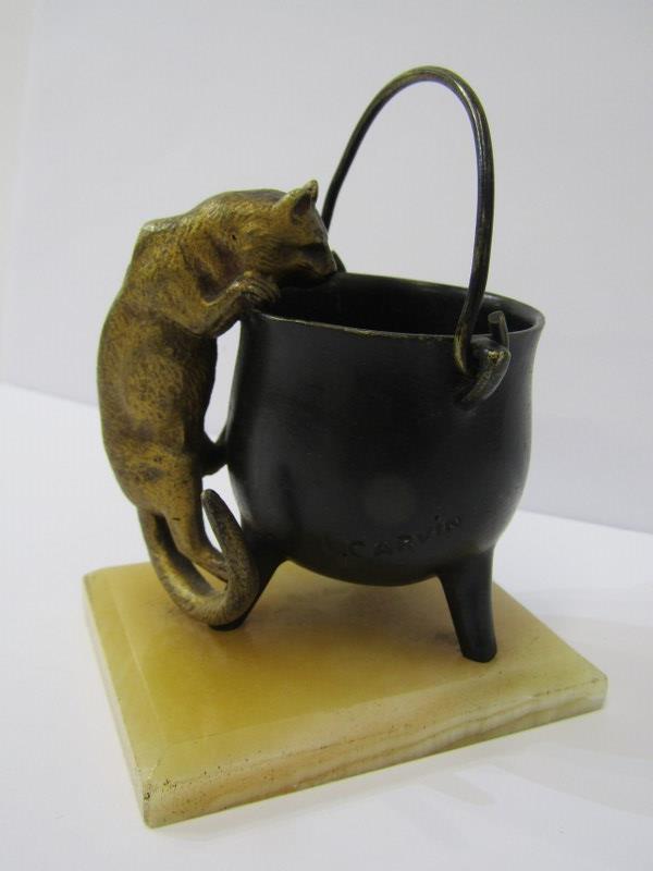 LOUIS CARVIN, early 20th Century bronze study of cat climbing up the side of a pale on an onyx base,