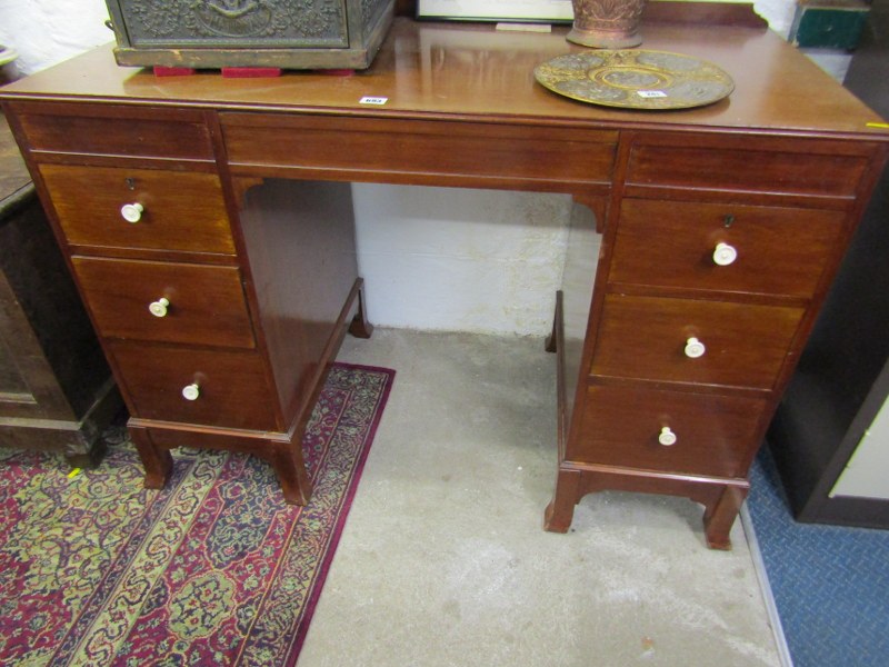 ART DECO MAHOGANY KNEEHOLE DESK, turned ivory knop handles with drop front central frieze drawer and