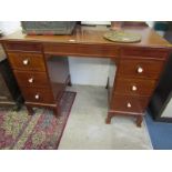 ART DECO MAHOGANY KNEEHOLE DESK, turned ivory knop handles with drop front central frieze drawer and