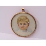 PORTRAIT MINIATURE OF A CHOIR BOY, of circular form in a 9ct gold case, Birmingham 1917, 5cm