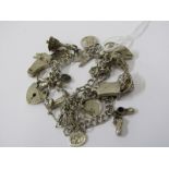 SILVER CHARM BRACELET, weighing approx. 51grms, various silver charms including grand piano, 18 key,