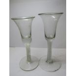 ANTIQUE GLASSWARE, 2 Georgian style double series cotton twist stem bell bowl glasses, 1 with foot