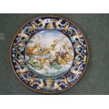 ITALIAN FAIENCE, Urbino-style 18.5" circular charger with central reserve depicting classical