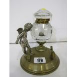 ANTIQUE INK WELL, cut glass ink well on circular brass base, with plated amorini figure, 6" height