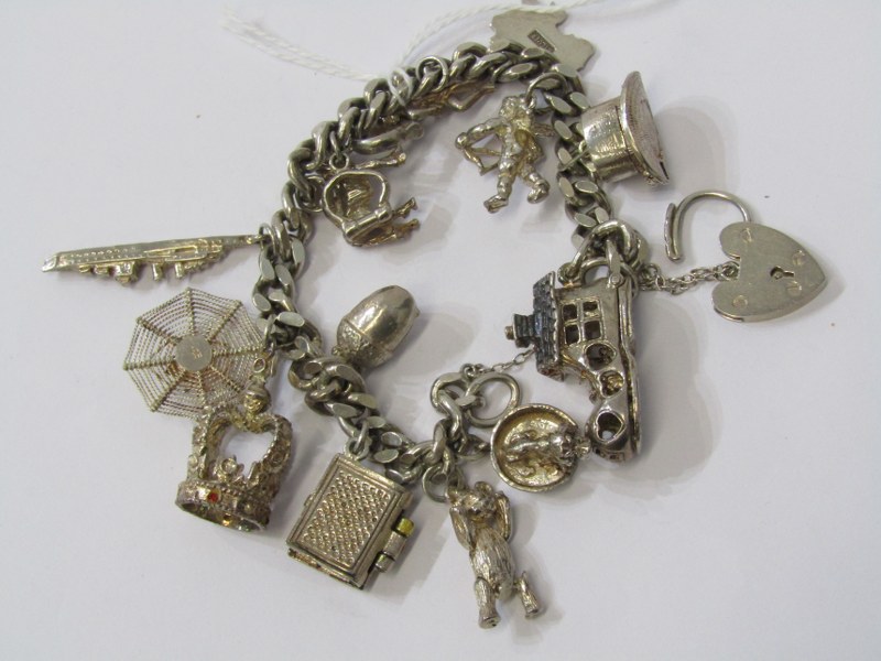 SILVER CHARM BRACELET with large selection of silver charms including opening boot, top hat,
