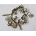 SILVER CHARM BRACELET with large selection of silver charms including opening boot, top hat,