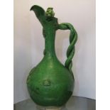 TURKISH POTTERY, 19th Century Canakkale green glazed wine jug, entwined handle with applied floral