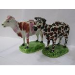 EARLY POTTERY COW CREAMERS, 2 polychrome decorated cow creamers, possibly Yorkshire with several