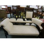 EDWARDIAN CHAISE LONGUE, ebonised carved and fretwork back rail with matching armchair & pair of