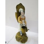 ANTIQUE FRENCH PORCELAIN GROUP, a camp follower on ormolu base, carrying gilt metal