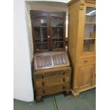 OAK BUREAU BOOKCASE, carved linen fold front above 3 drawers, 30" width