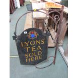 ENAMEL SIGN, "Lyons Tea Sold Here" double sided enamel sign with emblem to top, on a wrought iron