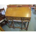 REPRODUCTION JACOBIAN DESIGN OAK BUREAU, on barley twist support frame, 3 geometric fielded short