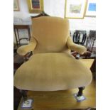 VICTORIAN UPHOLSTERED LOW BEDROOM ARMCHAIR, tapering legs with original ceramic castors