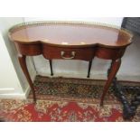 CONTINENTAL TREFOIL FRONTED DRESSING TABLE, pierced gilt metal gallery with slender cabriole legs