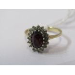 9ct YELLOW GOLD RED & WHITE STONE CLUSTER RING, principal oval cut red stone possibly garnet,