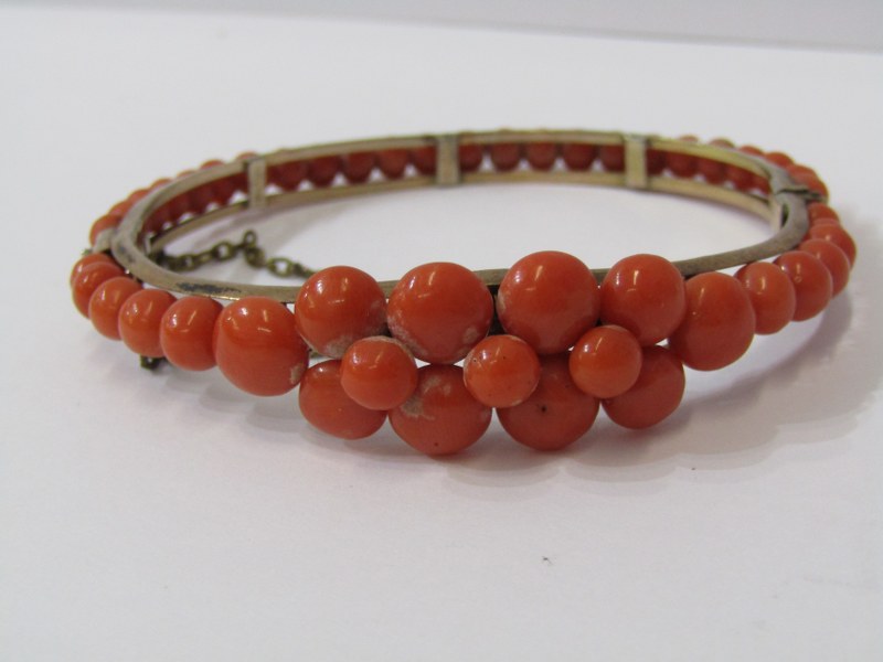 VICTORIAN YELLOW METAL CORAL HINGED BANGLE, with safety chain