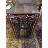 ORIENTAL FURNITURE, nest of 4 graduated carved rosewood occasional tables with stylised cloud band