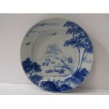 18th CENTURY ENGLISH DELFT, 9" dia plate decorated with Shepherd on hillside, Warren collection