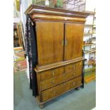 EARLY 18th Century walnut cabinet on chest base, twin doors enclosing compendium of short drawers