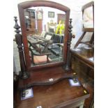 VICTORIAN MAHOGANY SWING DRESSING MIRROR, tapering pillar supports and serpentine fronted base