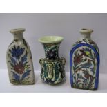 IZNIC, 2 triangular based 7" flasks decorated with polychrome floral designs, together with triple