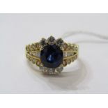 18ct YELLOW GOLD SAPPHIRE & DIAMOND RING, principal large cushion cut deep blue sapphire