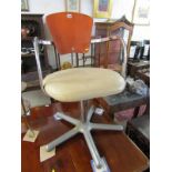 RETRO, a rare chrome and leather seated swivel armchair with plywood back rest