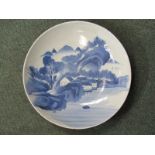 ORIENTAL CERAMICS, 19th Century 13.5" shallow bowl decorated with underglaze blue depicting