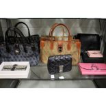 A good collection of ladies' handbags and purses.