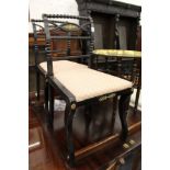 A pair of Regency ebonised and gilt metal mounted occasional chairs.