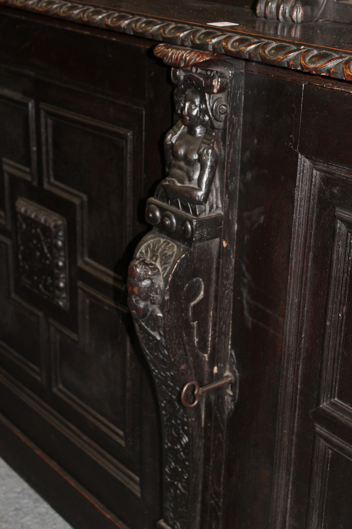 A late Victorian Gothic Revival carved oak cupboard bookcase. - Image 3 of 3