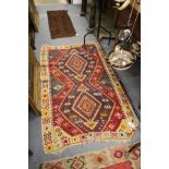 A Kilim flat weave rug.
