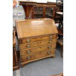 A George III oak bureau.