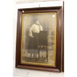 A photographic print of a young lady by a chair.