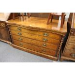 A good continental burr walnut four drawer chest with barley twist columns to each end.