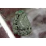 A Chinese carved jade amulet / pebble.