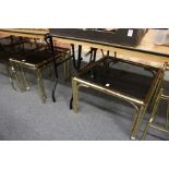 A brass faux bamboo and smoked glass coffee table together with a matching nest of tables.