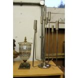 A glass and gilt metal vase and cover and a chrome candelabra.