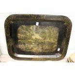 A 19th century Toleware rectangular tray decorated with a river scene with buildings and sailing