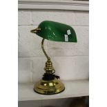 A brass desk lamp.