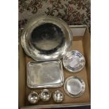 Silver plated coasters, a circular bowl and three salts.