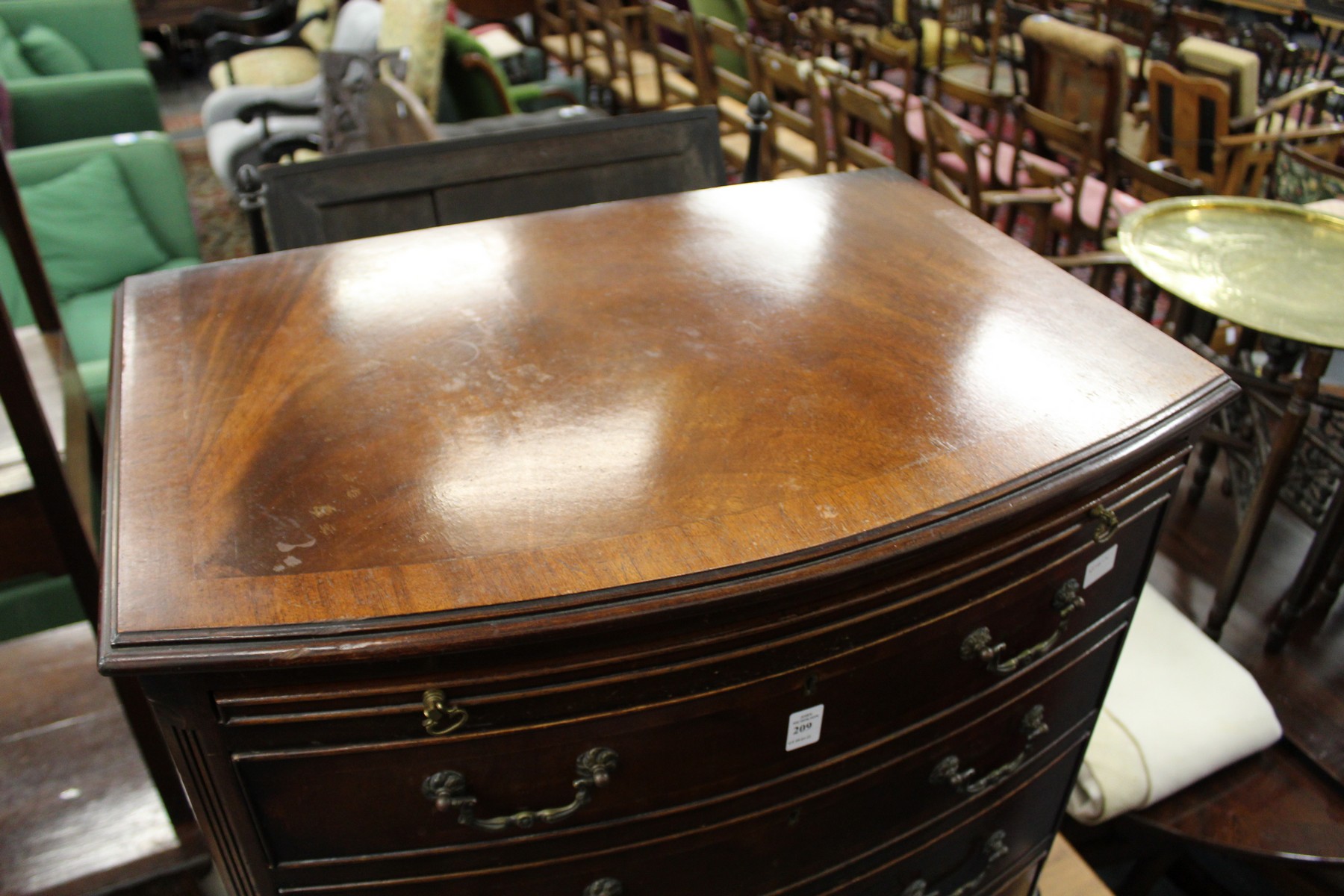 A George III style mahogany bow front four drawer chest with brushing slide. - Image 2 of 2