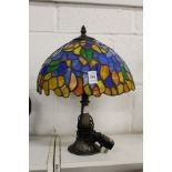 A small Tiffany style table lamp.