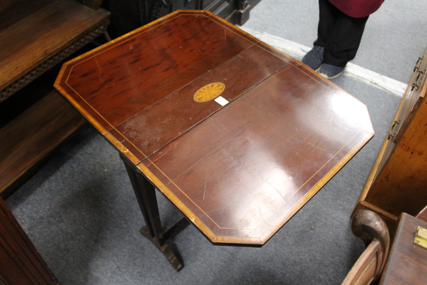 An Edwardian inlaid mahogany Sutherland table.