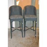 A pair of modern Lloyd Loom bar stools.