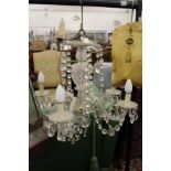 A Venetian style cut glass five branch chandelier.