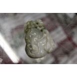 A Chinese carved jade amulet / pebble.