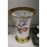 A Meissen floral decorated trumpet shaped vase.